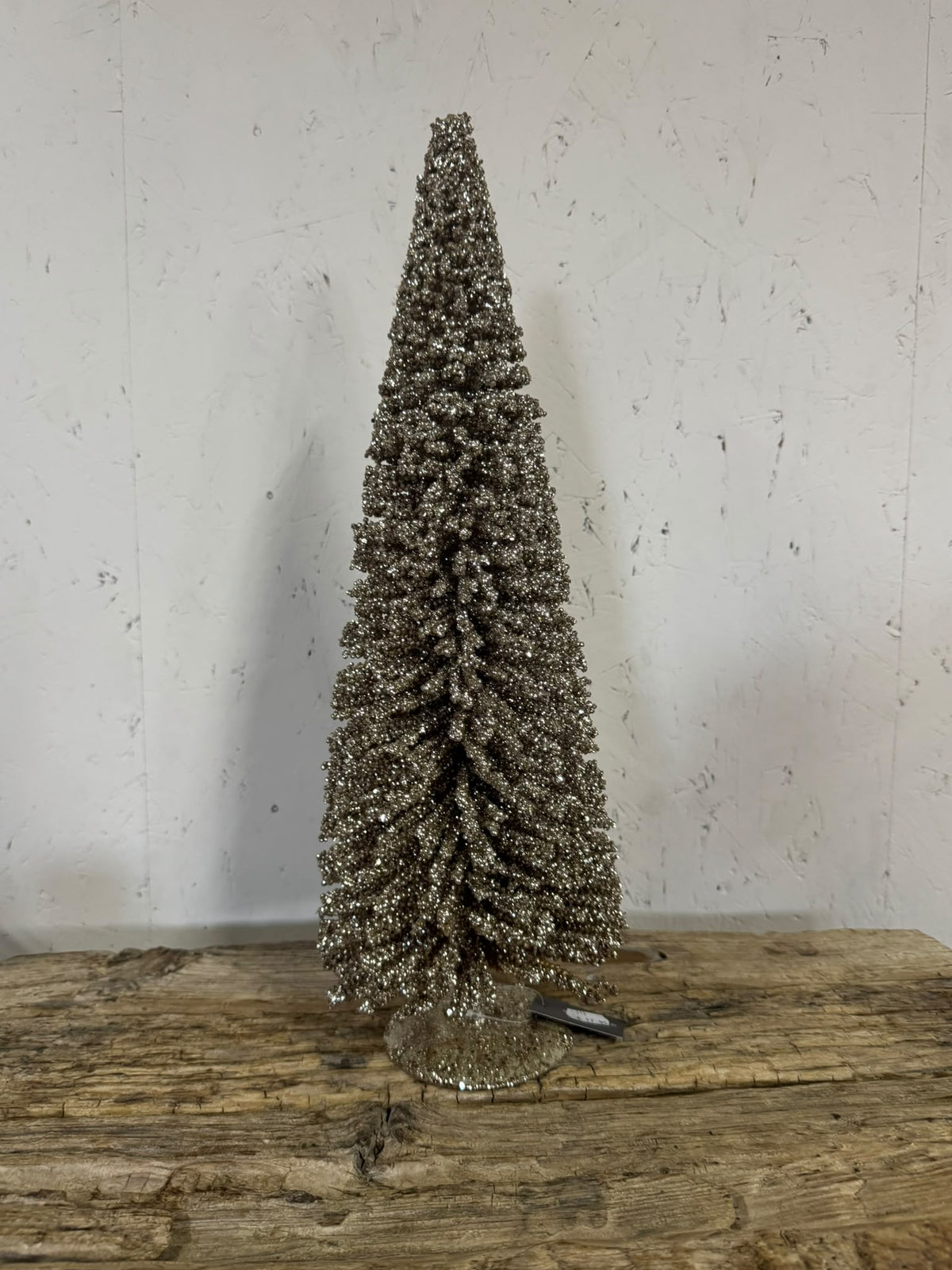 Decoratieve kerstboom met champagnekleurige glitter – klein en groot