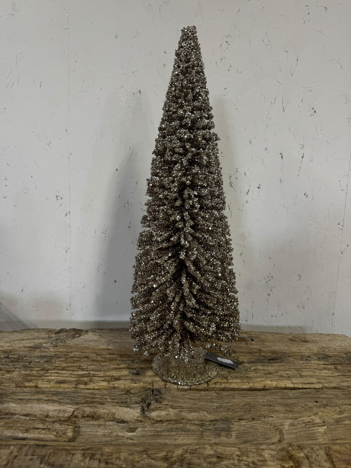 Decoratieve kerstboom met champagnekleurige glitter – klein en groot